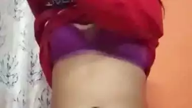 An 18-year-old desi nude girl strips and fingers her pussy