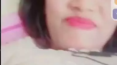 Smiling girlfriend video call to boyfriend shows boobs